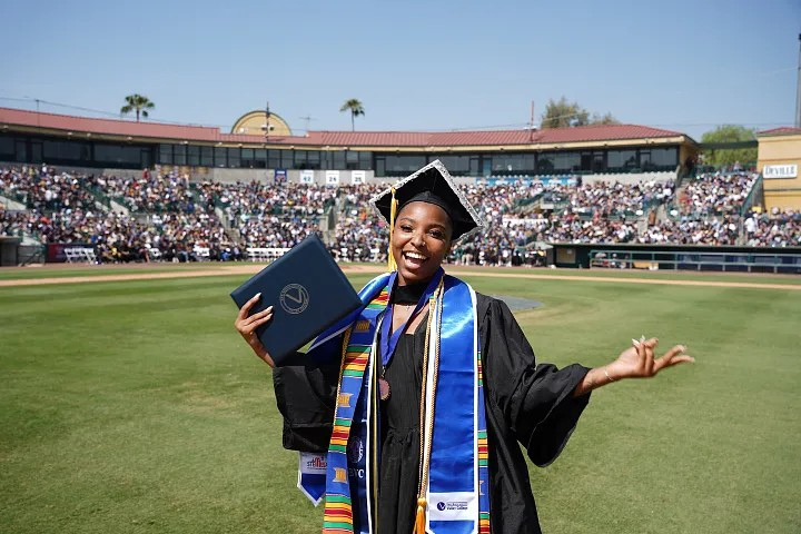 A graduate celebrates during San Bernardino Valley College’s commencement ceremony 